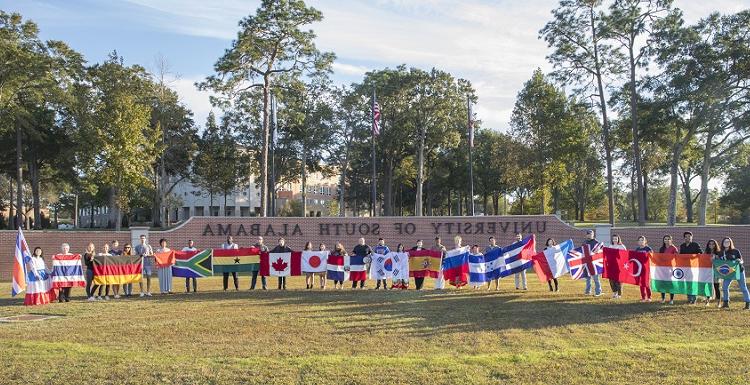 Students representing their home countries gather for a group photo as part of International Education Week. 